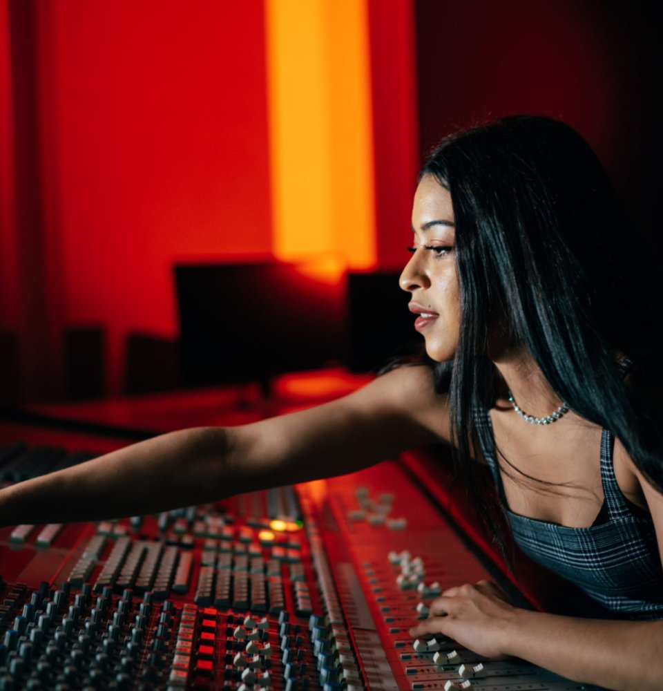 A picture of a student working on a production desk.