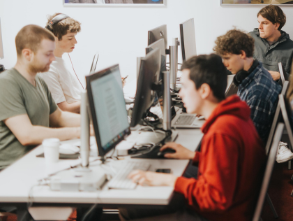 A group of students working in a computer lab.