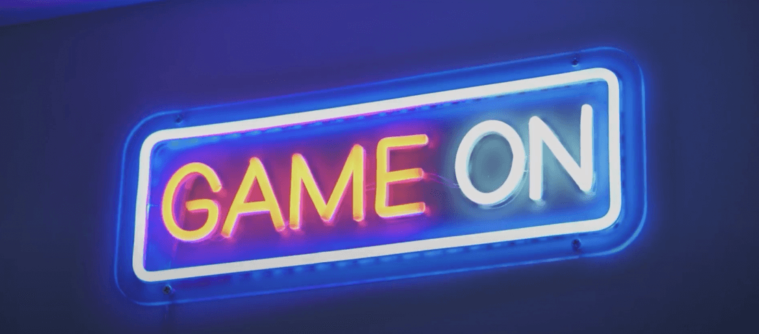 A neon sign of the phrase "Game On".