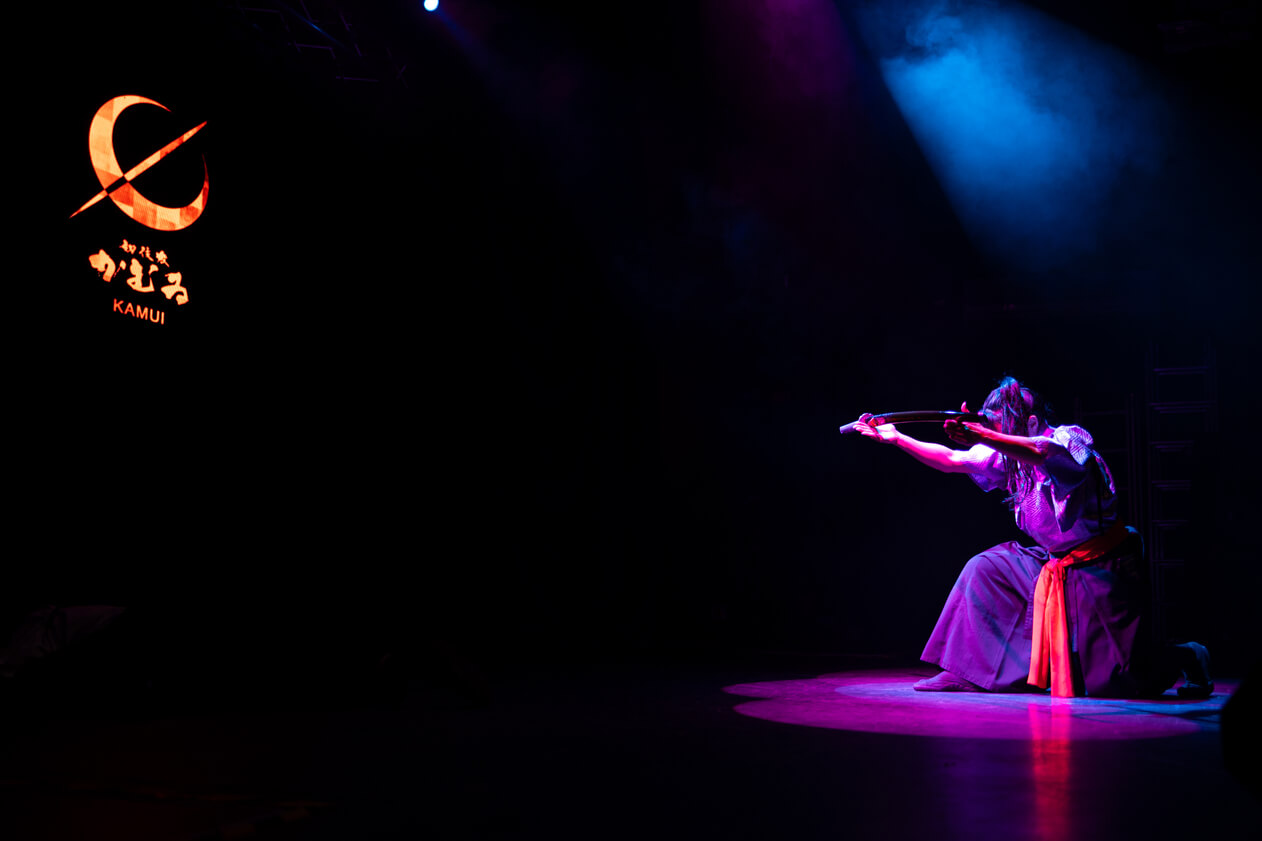 A picture capturing a performing artist at the Ikigai Japanese Festival.