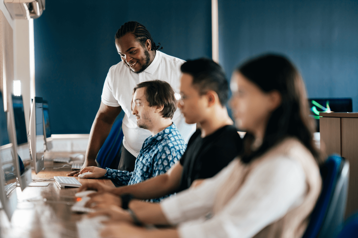 a group of students working at their computers