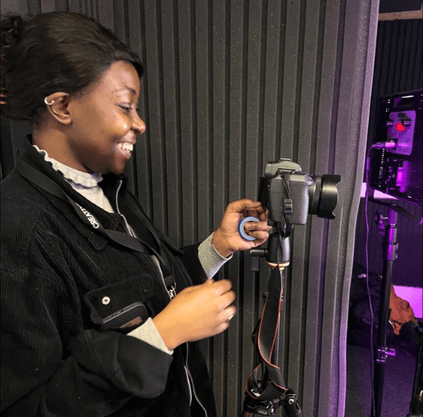 a female student operating a camera